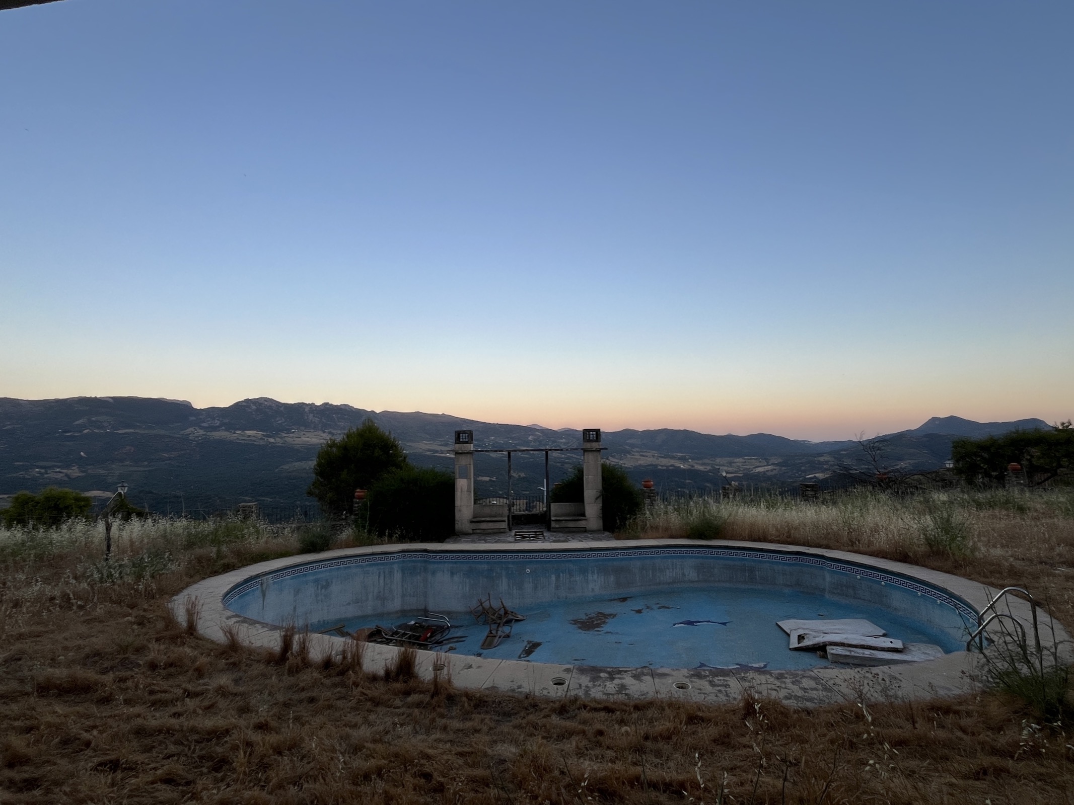 The swimming pool of an abandoned hotel