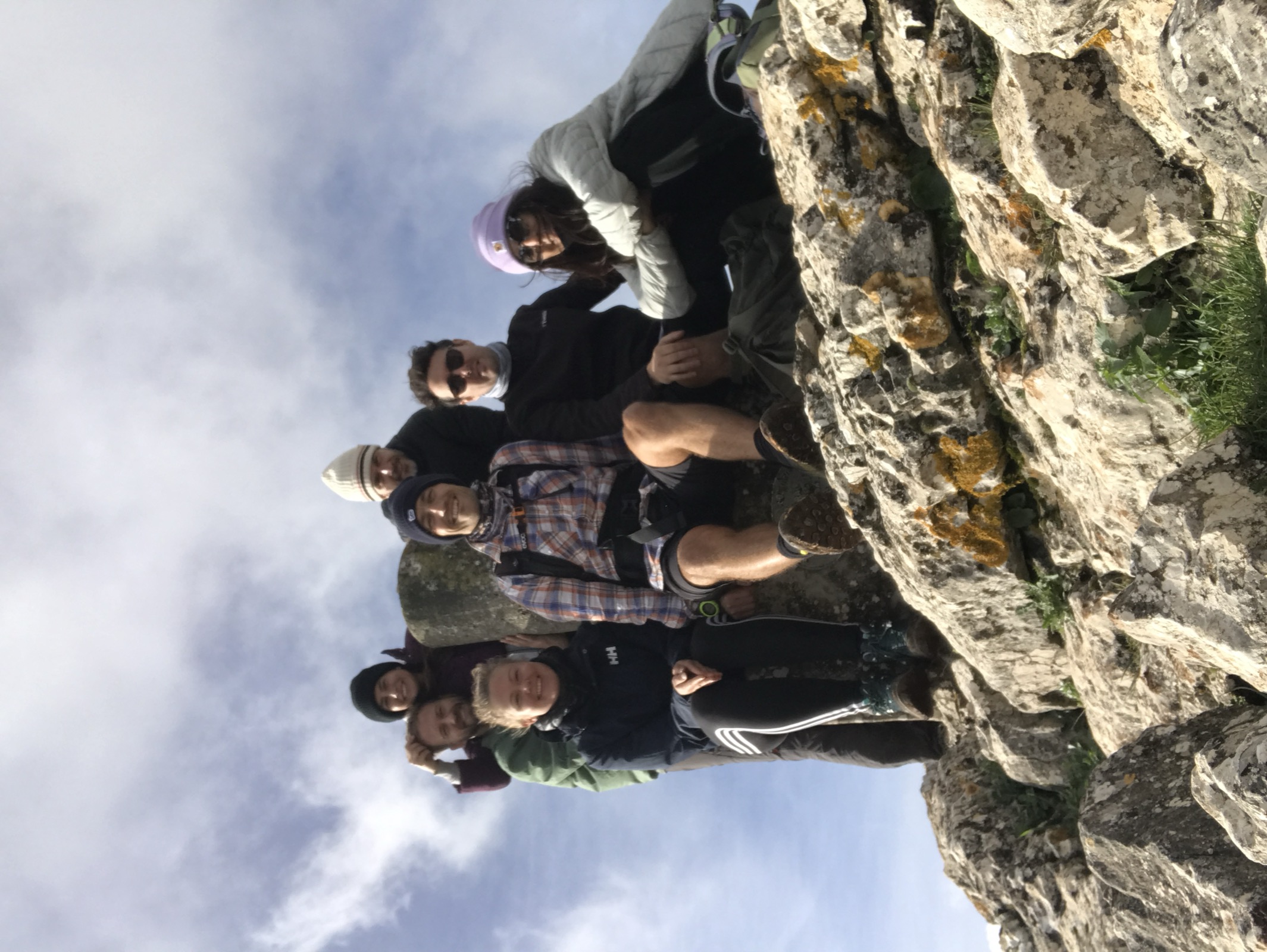 Group of friends on a rocky mountain ridge near Cortes de la Frontera