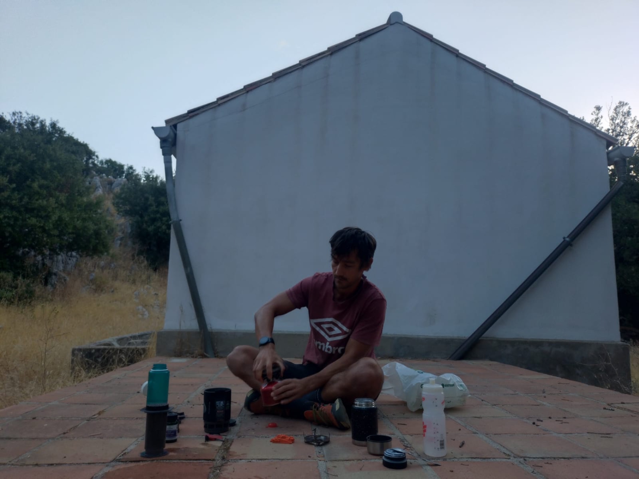 Camp setup with cooking gear in the mountains above Cortes