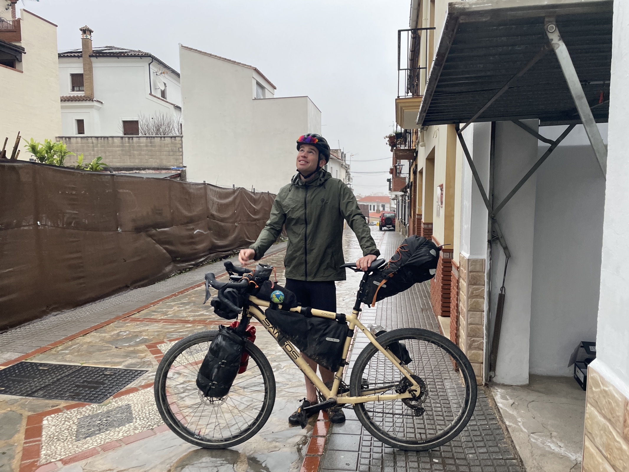 A touring cyclist setting off from Cortes after staying the night
